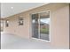 Covered patio featuring ceiling lights and sliding glass door to interior at 5587 Nw 40Th Pl, Ocala, FL 34482
