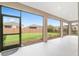 View from screened patio out to the green backyard and privacy fence at 5587 Nw 40Th Pl, Ocala, FL 34482