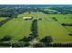A large farm estate with fenced pastures and tree lined drive at 5765 Nw 110Th St, Ocala, FL 34482