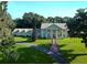 A stately home with a manicured lawn and tree lined drive at 5765 Nw 110Th St, Ocala, FL 34482
