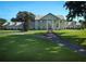 Classic estate home features a manicured lawn and tree lined drive at 5765 Nw 110Th St, Ocala, FL 34482