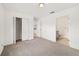 Bedroom with bi-fold closet, leading to a bathroom and a kitchen at 6 Locust Loop Crse, Ocala, FL 34472