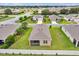 Aerial view of the home showcasing its spacious backyard, screened patio, and neighborhood at 6318 Sw 89Th Lane Rd, Ocala, FL 34476