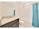 Well-lit bathroom featuring a granite countertop vanity, shower, and commode at 6318 Sw 89Th Lane Rd, Ocala, FL 34476