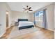 Cozy bedroom features a ceiling fan, and a large window at 6318 Sw 89Th Lane Rd, Ocala, FL 34476