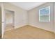 The bedroom offers neutral carpet and light-filled space at 6318 Sw 89Th Lane Rd, Ocala, FL 34476
