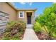 Close-up of the home's entrance, featuring a stylish front door and stone accents at 6318 Sw 89Th Lane Rd, Ocala, FL 34476