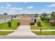 Charming single-Gathering home featuring a well-manicured lawn and a two-car garage at 6318 Sw 89Th Lane Rd, Ocala, FL 34476