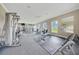 Spacious fitness center featuring weight training machines, cardio equipment, and mirrored walls at 6318 Sw 89Th Lane Rd, Ocala, FL 34476