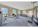 Community gym with weight machines, free weights, and bright windows for an energizing workout at 6318 Sw 89Th Lane Rd, Ocala, FL 34476