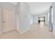 Bright hallway leading into a living area with views of the backyard at 6318 Sw 89Th Lane Rd, Ocala, FL 34476