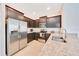 Well-equipped kitchen with stainless steel appliances, ample counter space, and rich wood cabinetry at 6318 Sw 89Th Lane Rd, Ocala, FL 34476