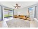Inviting living room with backyard views, lots of natural light, and sliding glass doors at 6318 Sw 89Th Lane Rd, Ocala, FL 34476