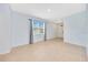Bright, open-concept living room with neutral-toned walls and tile flooring at 6318 Sw 89Th Lane Rd, Ocala, FL 34476