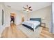 Comfortable bedroom with a ceiling fan, and a large window at 6318 Sw 89Th Lane Rd, Ocala, FL 34476