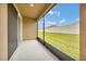 Relaxing screened patio with views of the large, well-maintained backyard at 6318 Sw 89Th Lane Rd, Ocala, FL 34476