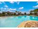 Beautiful community pool with lounge seating and trellis covered cabanas for shade at 6318 Sw 89Th Lane Rd, Ocala, FL 34476