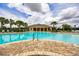 Resort-style community pool with a spacious pool deck and clubhouse in the background at 6318 Sw 89Th Lane Rd, Ocala, FL 34476