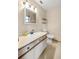 Bathroom featuring a vanity with a sink and a toilet, complemented by a medicine cabinet at 6497 W Anthony Rd, Ocala, FL 34479