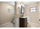 Charming bathroom with tile accents, classic vanity, and framed mirror at 6497 W Anthony Rd, Ocala, FL 34479