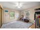 Bright bedroom with natural light, featuring two windows and neutral walls and carpet at 6497 W Anthony Rd, Ocala, FL 34479
