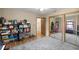 Bedroom featuring closet with mirror doors and built-in storage for toys and games at 6497 W Anthony Rd, Ocala, FL 34479