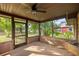 A screened in porch providing ample shade for plants and relaxing outside at 6497 W Anthony Rd, Ocala, FL 34479