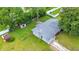 Aerial view of a cozy home with a spacious backyard and mature trees at 6511 Se 25Th Ave, Ocala, FL 34480
