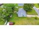 Aerial view showcasing the home's backyard, including a storage shed and perimeter fencing at 6511 Se 25Th Ave, Ocala, FL 34480