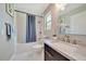 Bright bathroom featuring a shower-tub combination, granite countertop, and neutral color palette at 6511 Se 25Th Ave, Ocala, FL 34480