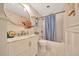 Bathroom with marble vanity, updated tile floor, and shower and tub combination at 6511 Se 25Th Ave, Ocala, FL 34480