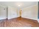 Bedroom with wood floors, double closet space, and adjacent access to hallway at 6511 Se 25Th Ave, Ocala, FL 34480