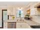 Close up of the kitchen with stainless steel appliances, granite countertops and a view to the outside at 6511 Se 25Th Ave, Ocala, FL 34480