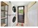 Convenient laundry area featuring a stacked washer and dryer at 6511 Se 25Th Ave, Ocala, FL 34480
