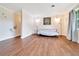 Spacious living room with wood floors, great natural light, and cozy seating arrangement at 6511 Se 25Th Ave, Ocala, FL 34480