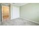 Light and airy bedroom with neutral paint, plush carpet and a closet for convenient storage at 6877 Minchew Cir, The Villages, FL 34762