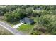 A lovely home nestled in lush greenery features a charming exterior and a well-manicured lawn at 75 Guava Ter, Ocklawaha, FL 32179