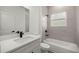 Bathroom featuring a vanity with quartz countertop and a shower-tub combo at 75 Guava Ter, Ocklawaha, FL 32179
