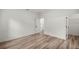 Bright bedroom with wood-look floors and a walk-in closet at 75 Guava Ter, Ocklawaha, FL 32179