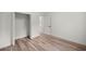 Bedroom with wood-look floors and a closet at 75 Guava Ter, Ocklawaha, FL 32179