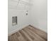 Spacious closet with wire shelving and wood-look vinyl flooring for easy organization and maintenance at 75 Guava Ter, Ocklawaha, FL 32179