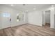 Bright, open living room boasts light wood floors, recessed lighting, and a large window at 75 Guava Ter, Ocklawaha, FL 32179