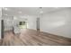 Spacious open-concept living area with wood-look floors and plenty of natural light at 75 Guava Ter, Ocklawaha, FL 32179