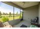 Relaxing screened lanai with views of the landscaped backyard and blue skies at 7881 Sw 89Th Cir, Ocala, FL 34481