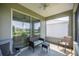 Comfortable screened lanai with seating, offering a relaxing outdoor space at 7881 Sw 89Th Cir, Ocala, FL 34481