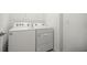 Laundry room featuring a white washing machine and dryer at 7881 Sw 89Th Cir, Ocala, FL 34481