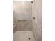 Shower features neutral tiling, a built-in seat, and a rainfall shower head at 7881 Sw 89Th Cir, Ocala, FL 34481