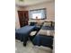 Bedroom featuring twin beds, a window, and built-in storage solutions at 8343 Sw 105Th Pl, Ocala, FL 34481