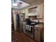 Compact kitchen with stainless steel appliances and ample cabinet space at 8343 Sw 105Th Pl, Ocala, FL 34481