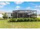 A well-maintained backyard, a perfect extension for outdoor relaxation with a screened lanai at 8802 Sw 79Th Loop, Ocala, FL 34481